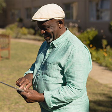 side-view-of-active-senior-man-using-digital-tablet